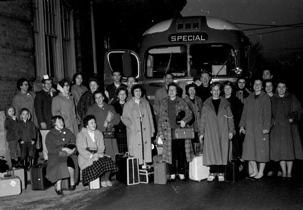 26 of the 33 Madison area youths who attended evangelist Billy Graham's three-day Youth for Christ Convention in Washington, D.C. posing for a group portrait after their return home.