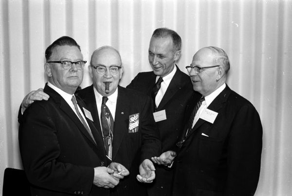 Henry Forrer (left), D. Lee Watts, George Heidt, and Rollie Black attend the West Side Business Men's annual banquet.