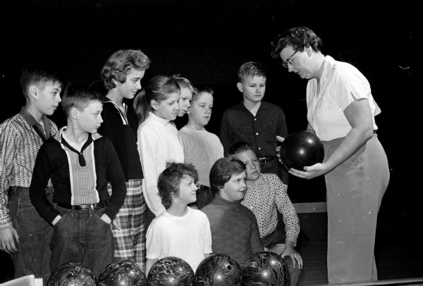 Madison bowler Doris Hanson instructs a group of youths 9-15 years of age during the first class of the "School of Bowling" held at the Bowl-A-Vard.