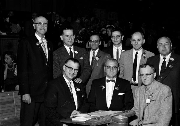 The nine officers and directors of WSBA are shown. Seated in the front row are, (left to right): secretary-treasurer Howard Petran' Milwaukee; Pres. Joe Meyer, Oshkosh;and director William (Hans) Gruettner, Milwaaukee.  Standing are, (left to right): directors Matt Zwank, president of the Madison Bowling Association.; Art Boettcher, Baraboo; Clarence Raatz, Sheboygan; Lee Edwards, Watertown; Ray Mihm, Green Bay; and Maurice Powell, Beaver Dam. It was the start of the group's 58th annual tournament.