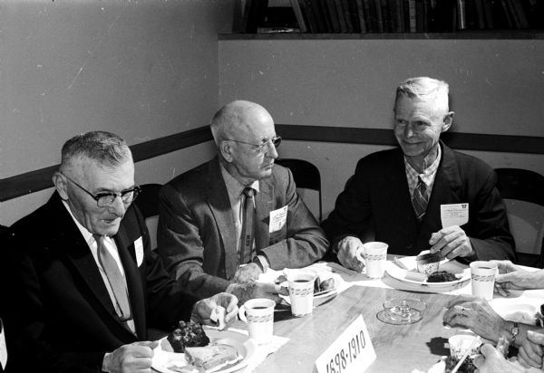 A reunion of farm leaders whose education came through the Short Course is held each year during Farm and Home Week. These leaders, left to right, are George Mitchell, Sun Prairie; J.G. Milward, Madison; and Hobart Germansen, Milltown.