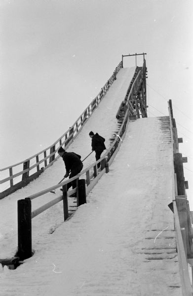 Skiers work on the Blackhawk Ski Club's big slide.