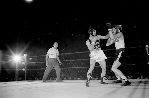 Wisconsin's John Drye fights with Jerry Armstrong during the boxing match between the University of Wisconsin and Idaho State at the UW Fieldhouse.