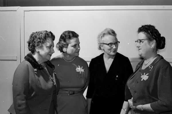 Three state P.E.O. officers visit with Mrs. Sayda Pettersen (right) who planned the ceremonies for the new BY chapter in Madison. Left to right are: Mrs. Constance Elvehjem, state president; Mrs. Roger S. Hubbell of Wauwatosa, first vice-president; and Mrs. Harold S. Vincent, second vice-president.