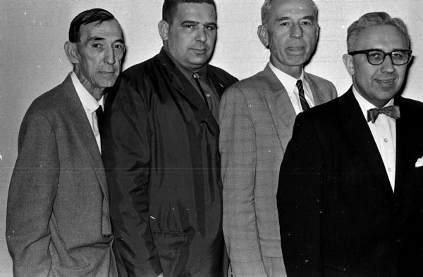 Delegates attend the annual meeting of the Wisconsin Veterans' Council. They include, left to right: I.G. Statz, Lloyd Tegge, I.D. Hale, and Robert Schroeder.