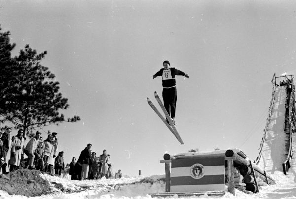 Bob Immens, Chicago, takes off from ski jump at the Blackhawk Ski Club ski jumping event held at Tomahawk Ridge.