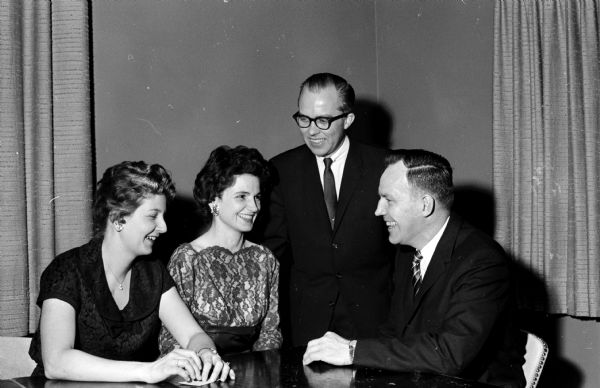 Shown at a table, left to right: Carol Robb, Margarete Anderson, Doral Robb, and Donald Anderson.