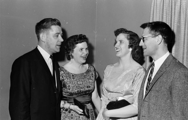 Two officers and their wives chat during the dance held by the newly organized West Side Kiwanis Club. From left to right are: the Rev. Robert Towner, president; Helen Towner; Beatrice Anderson; and Alonzo Anderson, secretary.