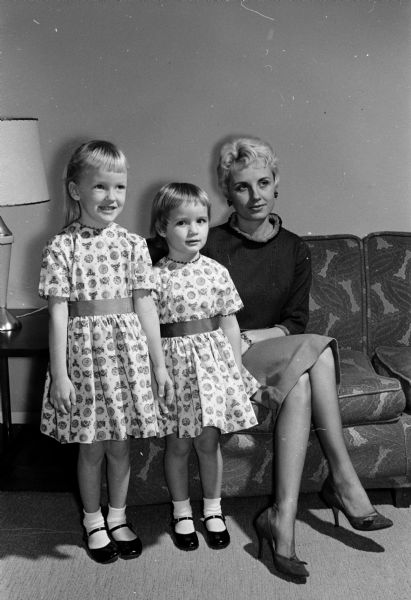 Mrs. John Du Bois, general chairman of the University League Junior Division Style Show, is shown with her daughters, Debbie, age 4 1/4, and Jan Marie, 3 1/2. The girls will model while their mother provides the commentary.
