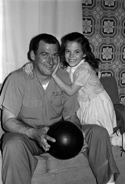 Ernie Kalar is shown with his proud 7-year-old daughter, Susan, after bowling a perfect 300 game at Schwoeglers' Lanes in an AFL Major League competition.