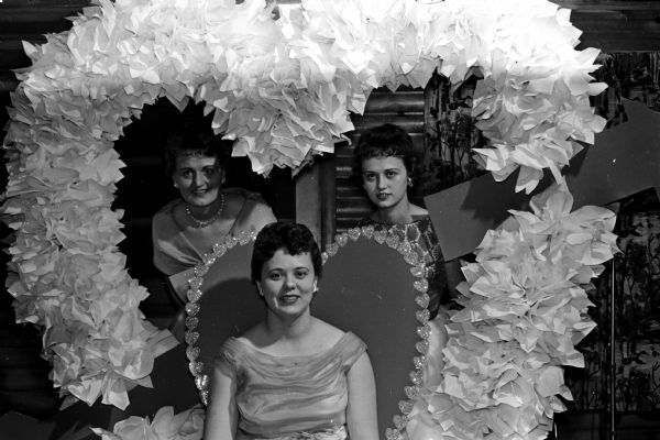 The sorority's "Queen of Hearts" (center) posing with two other candidates for the title at the Epsilon Sigma Alpha benefit dance. Left to right: Karen Foss, Mildred Televick and Monica Weiner.  The event raised funds for the new Wisconsin Central Colony, an institution for mentally disabled children.