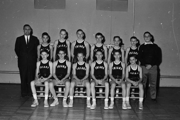 Blessed Sacrament tied with St. Bernard for first place in the Madison Parochial School league basketball race. They then lost to St. Bernard in the championship playoff. The Blessed Sacrament team is pictured, left to right, front row: Bill Clark, Mike Owens, Greg Zwettler, Jim Beavers, Jim Pfeifer, Paul Kobussen. Back row: Coach Dan Kobussen, Ted Van Thullenar, Bob Knight, Mike Fox, Tom Rohlich, Tim Sweeney, Tom Corcoran, Tom Bosold, Manager Dave Markee.