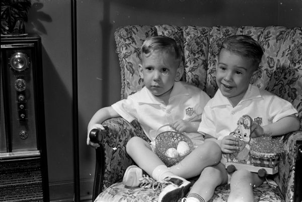First cousins Kenneth Miller, left, and Tommy Gruber celebrate their third birthday.  They're shown with their Easter baskets. The cousins were born on the same day at Madison General Hospital and their mothers shared a hospital room.