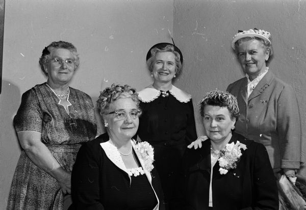 Women's Missionary Federation officers attend a gathering of the Madison Circuit of Women of the Evangelical Lutheran Church in Madison. Seated, left to right, are: Mrs. John Mell of DeForest, and Mrs. Clarence Anthony of Rio. Standing, left to right, are: Mrs. Arthur Anderson of Madison, Mrs. Inez Steen of Madison, and Mrs. Doris Nelson of Westport.
