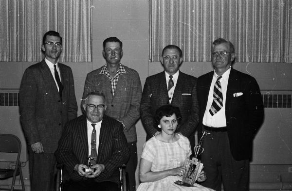 Among the sharpshooters at the Mount Horeb Rifle Club banquet are, left to right, seated: Ted Church; Mrs. Virgil Turk; Standing: Rev. Alvin Pinke; Elmer Schult, secretary-treasurer; Russ Pope and Forrest (Pops) Henderson, president of the Southwestern Rifle League.