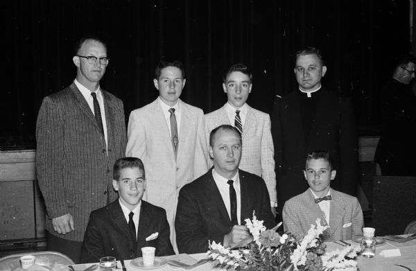 Some of those attending the St. Bernard Grade School football and basketball team banquet are, left to right, front row: Bob Dye, basketball co-captain; John Orr, University of Wisconsin assistant basketball coach; Pat Kinney, football co-captain and most valuable basketball player. Back row: Verlyn Belisle, Madison East High School basketball and baseball coach; Rick Miller, football co-captain and most valuable player; Dave Niesen, basketball co-captain; the Rev. Donald Linz, athletic director and acting pastor of St. Bernard.