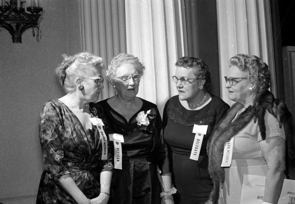 Delegates at the Wisconsin Federation of Women's Clubs convention. Left to right: Mrs. Floyd Burrill (Eau Claire), Mrs. James Connell (Pewaukee), Cassie Raasoch, and Zella Wilkins.
