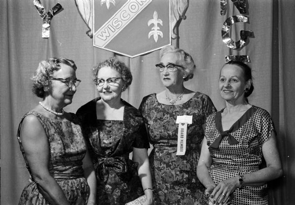 State board members arrive for the three day convention of the Wisconsin Federation of Women's Clubs. Left to right: Mrs. R.E. Lange, Sr. (Stevens Point); Mrs. Raymond Rightsell (Stevens Point); Mrs. Darwin Follette (Coloma); and Mrs. Gordon M. Stoddard (Green Lake).