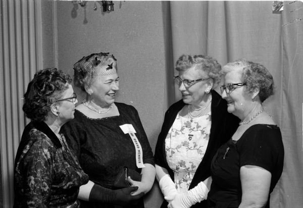 State board members of the Wisconsin Federation of Women's Clubs are honored at the convention. Left to right: Adeline Motl (Middleton); Mrs. Ray Martens (Merrill); Mildred Horne (Madison); and Mrs. Melvin Bonn (Bloomington).