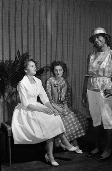 Three members of the Truax Field Non-Commissioned Officers Wives Club take part in the entertainment at a party of the officers and their wives. Left to right: Pennee Leidheisl, Route 4; Mrs. Lou Deschner, Oregon, and Jean Hill, Madison.