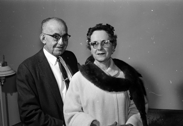 Portrait of Ralph and Isabel Pearson of 5030 Lake Mendota Drive. Isabel is wearing a mink scarf made from several minks Ralph trapped in their back yard along the shoreline of Lake Mendota. The furrier who fashioned the skins into a fur piece described the fur as being from small female wild minks, colored dark brown with blue undercoats and extremely silky and soft.