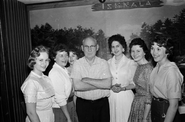 Clement Kane, center, an employee of the U.S. Armed Forces Institute, celebrates his upcoming retirement by treating fellow employees to lunch. The group includes, from left to right: Roberta Beale, Helen Hart, Shirley Ryan, Kane, Elouise Elbow, Judy Lovesee and Carol Skroch.