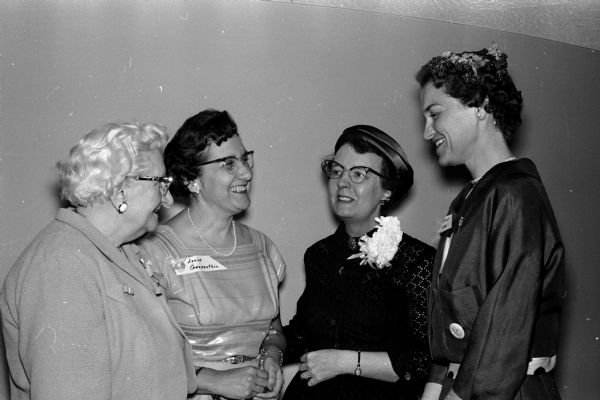 Participants in the Nurses Association spring banquet chat before the event. From left to right are: Nellie Brown, Louise Grapenthin, Eleanor Lambertsen (assistant secretary to the American Hospital Association Council on Professional Practice and speaker at the banquet), and Elaine Ellebee.