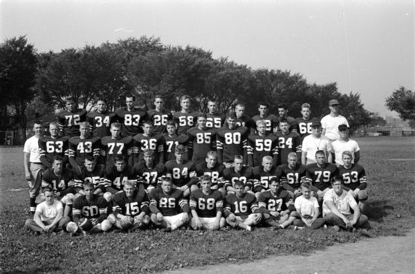 Team portrait of the Madison East High School football team.