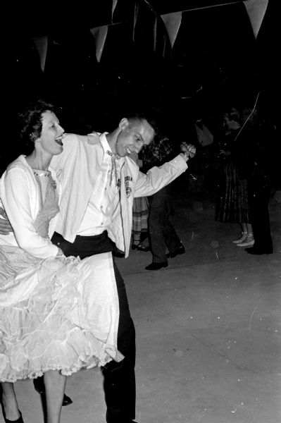 John and Mary Bierlein participate in the square dance at the Westgate Shopping Center as part of a Montgomery Ward open house.