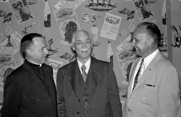 Members of the Lions Club and their guests gather at the Park Hotel to mark the 37th annual observance of Constitution Day, the 173rd anniversary of the signing of the American Constitution. Shown (left to right) are: Rev. Howard Finnegan, St. Mary's of the Nativity Catholic Church, Marshall, Edward F. Fairchild, former chief justice of the state Supreme Court; and Bernard Reese, president of the Lions Club.