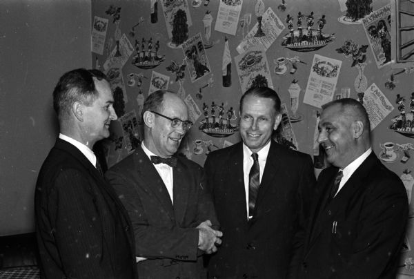 Members of the Lions Club and their friends gather at the Park Hotel to mark the 37th annual observance of Constitution Day. The day marks the 173rd anniversary of the signing of the American Constitution. Shown (left to right) are: Judge William Sachtjen, Small Claims Court; Judge Norris Matone; UW President Conrad Elvehjam; and George Young, dean of the U.W. Law School.