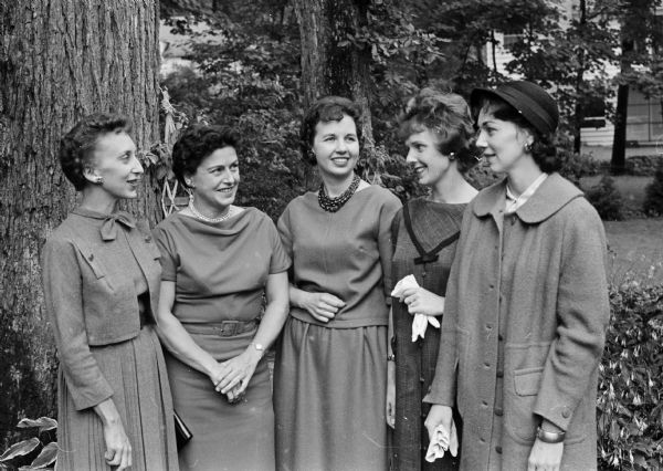 Officers of the Women's Architectural League of Madison attending an invitational tea for wives of architects. Pictured in the garden are, left to right, Patricia Graven, Edna Morris, Lucille Torkelson, Janet Busch, and Donna Korenic.