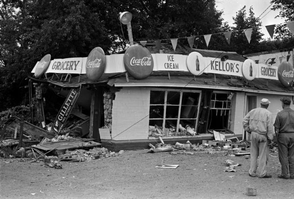 The Kellor's Grocery Store and Garage on Highway 14 (Oregon Road) in the Lakeview district 8 miles south of Madison was demolished September 19 by a blast resulting from accumulated gasoline fumes. Two men are standing on the right looking at the damage.