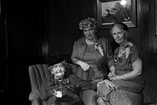 Grace Conover, seated, who recently celebrated her 96th birthday and who is believed to be the oldest living woman graduate of the University of Wisconsin, is shown with two other past presidents of the Woman's Club.  They are Celia Tatum and Ethel Van Hagan.