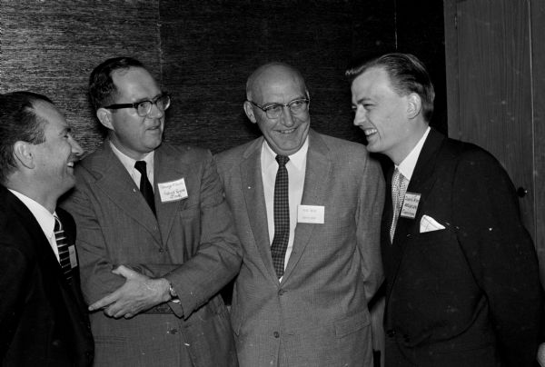 Members of the Society for the Advancement of Management (SAM) gather at the Towne Club, 306 W. Mifflin Street, to hear a talk entitled "The Economic Outlook-a Practical Approach" by George W. Cloos, senior economist for the Federal Reserve Bank, Chicago. Shown (left to right) are: Joseph C. Schabacker, chairman of the UW Extension Department of Commerce; Mr. Cloos; C.T. Metz, Ray-O-Vac Co. manager of government sales; and Svend Jensen, guest from Copenhagen, Denmark.