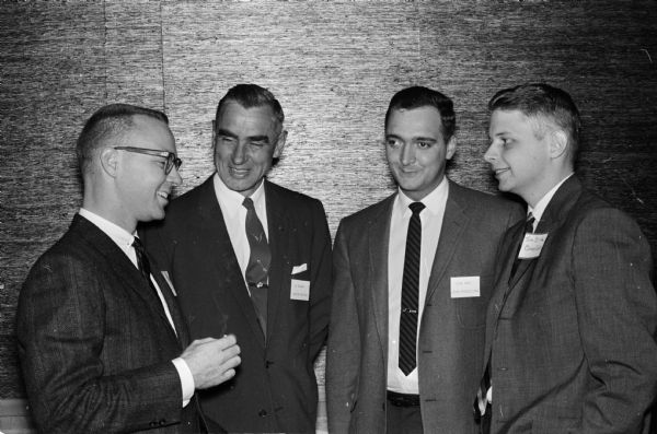 Members of the Madison Society for the Advancement of Management (SAM) meet at the Towne Club, 306 W. Mifflin Street. Shown (from left to right) are: Richard Wilson, Oscar Mayer Company; Ed Bryant, Nelson Muffler Company; Richard Hood, Secretary of SAM, Litho Productions; and Thomas Brink, Carnes Company.