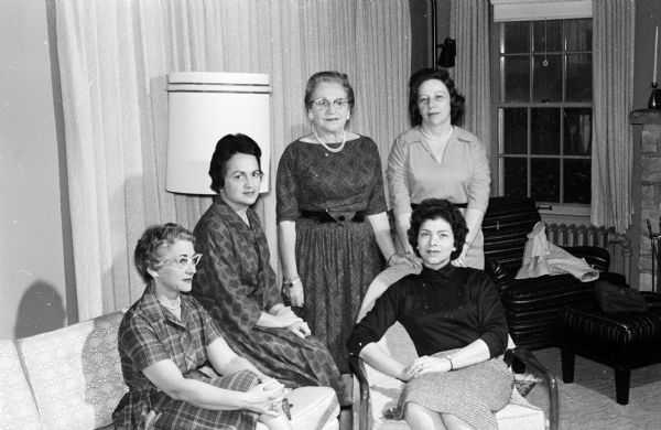 Some of the planning chairmen of the Hadassah Eye Bank fund-raising luncheon pose around a couch and chairs. They include, left to right: Elizabeth Woods, Frances Weinstein, Celia Rosenberg, Rae Schwatz, and Doris Simon.