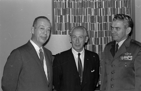 Shown in center is Major Alexander P. de Seversky, pioneer in aeronautical design and engineering, and speaker at the Air Power banquet at the Wisconsin Memorial Union. Talking with him are Ed Diener (left) president of the Madison Chamber of Commerce and Major Gen. James C. Jensen, commander of the 30th Air division at Truax Field.