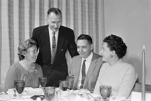 Irma Kress, Francis Kress, Henry Hron and Lilah Hron Richard and Jean Potter attend a Christmas party thrown by Robert and Irwin Goodman for the employees of Goodman Jewelers. The Goodman brothers turned over a $100 check for the Empty Stocking Club which provides toys for children.