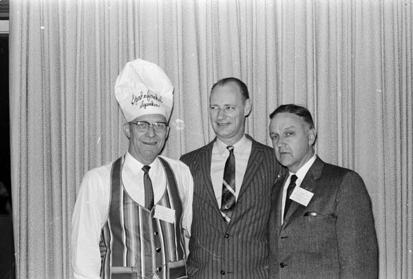 Present at the Contractors 'Sphanferkel,' a pork roast feast at which contractors meet socially with manufacturers, suppliers, and sales representatives with whom they do business, are left to right:  Joseph Kearney, Evanston IL; Hollis Cannon and R. F. Pharo.   

