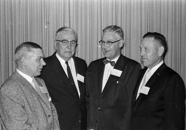 Present at the Contractors 'Sphanferkel,' a pork roast feast at which contractors meet socially with manufacturers, suppliers and sales representatives with whom they do business, are left to right: Walter Feld; Fred Dannies, Wauwatosa; Ralph Culbertson, State Bureau of Engineering; and Harold Brieby.   
