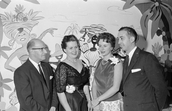 Attendees at the annual benefit dinner dance of the Woman's Auxiliary to the Dane County Medical Society. They are, from left to right: Dr. A.P and Adeline Schoenenberger, and Louise and Dr. John Scott.