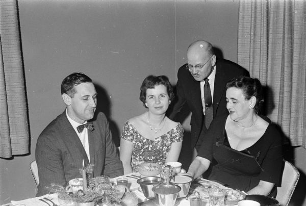 Robert Torkelson and Lucille Torkelson head the Madison AIA chapter and the women's group. They are seated with Stanley Nerdrum and Eleanor Nerdrum.