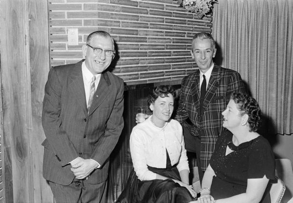 Herbert Bradley, left, is secretary-treasurer of the AIA group. He is shown with Mrs. and Mr. John Steinman of Monticello, and Ruth Bradley.