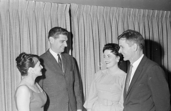Two active members of the Women's Architectural League are shown with their husbands. On the right is Suzanne Cashin and Morton Newcomb. On the left is Edythe Newcomb and Robert Cashin.