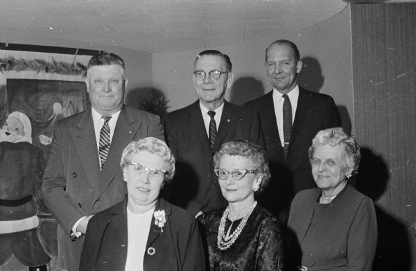 Mayor Ivan Nestingen is shown with five of thirteen city employees honored for service to Madison at a Christmas party at Welch's Embers restaurant. Six who received engraved desk sets in appreciation of 35 years of service to Madison, left to right, are: Marion Bergenske, Vocational school; Lydia Reed, building inspection; and Margaret Moss, board of education.  Back row left to right are William Frisch, streets department; Gordon Nelson, board of education; and Ivan Nestingen. Marie Henry, board of education, also received the 35 year award.