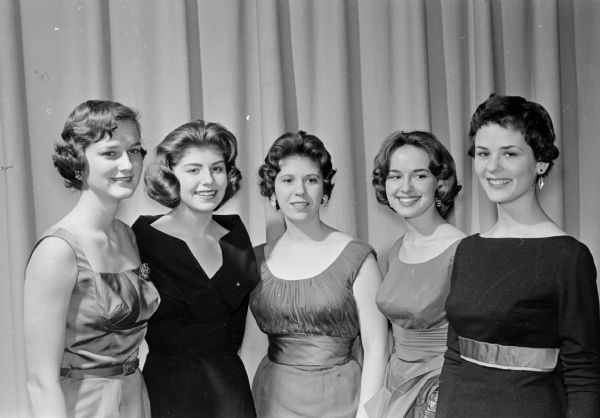 Scenes from "Here We Go Again", an amateur variety show put on as entertainment for the 1961 Twelfth Night party at Nakoma School. Five University of Wisconsin co-eds, all of whom live in Nakoma, formed a chorus and participated in the show. Left to right: Jane LaCourt, Suzanne Holly, Ruth Rausenberger, Debbie Bainbridge, and Karen Leveque.