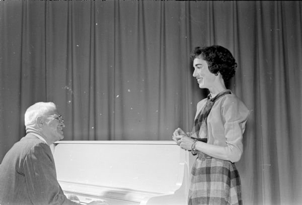 Scenes from "Here We Go Again", an amateur variety show put on as entertainment for the 1961 Twelfth Night party at Nakoma School. Two former residents, Charles W. Tomlinson at the piano and Gayle Cody, at right, took prominent roles in the variety show.