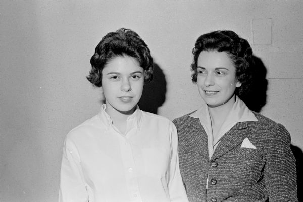 Portrait of fourteen year old Maureen, left, and Thada Richman, mother and daughter bowlers in the Unemployment Compensation League. Maureen is described as a "bowling star of the future."