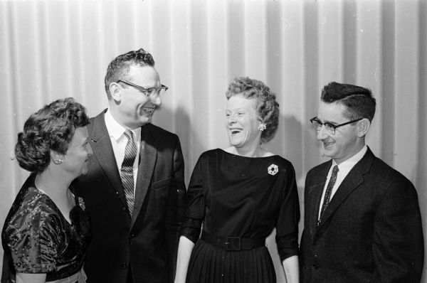 Cecelia and Ken Miller and Dorothy and John Switzky  share a moment of laughter.